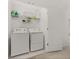 Convenient laundry room with washer, dryer, and shelving at 161 Mandovi St, Davenport, FL 33837