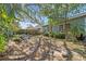 Landscaped backyard with fire pit and seating at 1613 Oriole Ave, Orlando, FL 32803