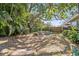 Backyard with fire pit and tropical plants at 1613 Oriole Ave, Orlando, FL 32803