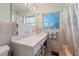 Clean bathroom with a shower/tub combo and updated fixtures at 1613 Oriole Ave, Orlando, FL 32803