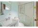 Small bathroom with shower stall, sink, and toilet at 1613 Oriole Ave, Orlando, FL 32803