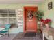 Inviting front door with wreath and potted plants at 1613 Oriole Ave, Orlando, FL 32803