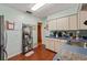 Charming kitchen with hardwood floors and updated cabinetry at 1613 Oriole Ave, Orlando, FL 32803