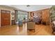 Living room with hardwood floors, built-ins, and vintage furniture at 1613 Oriole Ave, Orlando, FL 32803