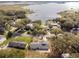 Aerial view of a renovated home near a lake at 16247 Lake Johns Cir, Winter Garden, FL 34787