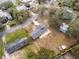 Aerial view of a newly renovated home with a large yard and landscaping at 16247 Lake Johns Cir, Winter Garden, FL 34787