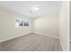 Bright bedroom with wood-look floors and large window at 16247 Lake Johns Cir, Winter Garden, FL 34787