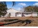 Newly renovated home with light grey exterior and white accents at 16247 Lake Johns Cir, Winter Garden, FL 34787