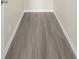 Simple hallway with wood-look floors at 16247 Lake Johns Cir, Winter Garden, FL 34787