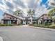 Community center entrance with palm trees and landscaping at 17791 Passionflower Cir, Clermont, FL 34714