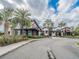 Modern community clubhouse with palm trees and landscaping at 17791 Passionflower Cir, Clermont, FL 34714