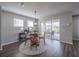 Bright dining room with sliding glass doors leading to the backyard at 17791 Passionflower Cir, Clermont, FL 34714