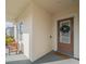 Front porch with two wooden chairs, welcoming entrance at 17791 Passionflower Cir, Clermont, FL 34714