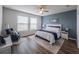 Main bedroom with a ceiling fan and ensuite bathroom at 17791 Passionflower Cir, Clermont, FL 34714