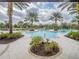 Community pool with palm trees and plenty of lounge space at 17791 Passionflower Cir, Clermont, FL 34714