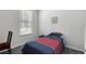 Small bedroom with a twin-size bed and a window, perfect for a guest or  at 2340 Grasmere View S Pkwy, Kissimmee, FL 34746