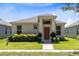 Front view of a single-story house with landscaping at 2340 Grasmere View S Pkwy, Kissimmee, FL 34746