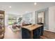 Dining area with a wooden table, blue velvet chairs, and view of living room at 2584 Kinsale Ln, Ormond Beach, FL 32174