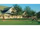 Personal putting on a green near a golf clubhouse at 2584 Kinsale Ln, Ormond Beach, FL 32174