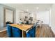 Modern kitchen with gray cabinets, white countertops, and an island with seating at 2584 Kinsale Ln, Ormond Beach, FL 32174