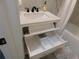 Bathroom featuring a white vanity with drawers and sleek black hardware at 2592 Grassy Point Dr # 106, Lake Mary, FL 32746