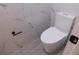 Modern bathroom featuring a toilet and marble-look walls at 2592 Grassy Point Dr # 106, Lake Mary, FL 32746