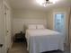 Inviting bedroom features a plush bed, closet and bathroom access, and modern decor at 2592 Grassy Point Dr # 106, Lake Mary, FL 32746