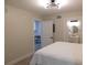 A neutral bedroom featuring two doorways leading to the bathroom and laundry area at 2592 Grassy Point Dr # 106, Lake Mary, FL 32746