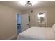 Comfortable bedroom with modern lighting, ensuite bath and laundry room at 2592 Grassy Point Dr # 106, Lake Mary, FL 32746