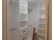 Well-organized closet with custom shelving and drawers, providing ample storage space at 2592 Grassy Point Dr # 106, Lake Mary, FL 32746