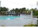 Relaxing community pool with surrounding patio and fence at 2592 Grassy Point Dr # 106, Lake Mary, FL 32746