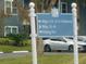 Community directional sign indicating buildings and fishing pier, enhancing navigation within the community at 2592 Grassy Point Dr # 106, Lake Mary, FL 32746