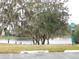 Community lake view with dog waste station at 2592 Grassy Point Dr # 106, Lake Mary, FL 32746