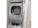 Stackable washer and dryer in a convenient laundry room at 2592 Grassy Point Dr # 106, Lake Mary, FL 32746