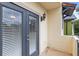 Private balcony with french doors and wall-mounted light at 2607 E Jefferson St, Orlando, FL 32803