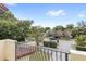 View from balcony showcases a tree-lined street and houses at 2607 E Jefferson St, Orlando, FL 32803