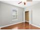 Bedroom with hardwood floors, neutral walls, and a closet at 2607 E Jefferson St, Orlando, FL 32803