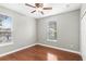 Bedroom featuring hardwood floors, neutral walls, and two windows at 2607 E Jefferson St, Orlando, FL 32803