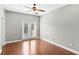 Bright bedroom with hardwood floors, french doors and ceiling fan at 2607 E Jefferson St, Orlando, FL 32803