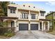 Front view of a charming two-story duplex with attached garages at 2607 E Jefferson St, Orlando, FL 32803