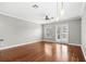 Living room with hardwood floors, french doors, and ceiling fan at 2607 E Jefferson St, Orlando, FL 32803