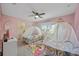 Bedroom with two twin beds and princess theme at 2715 Manesty Ln, Kissimmee, FL 34747