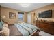 Large bedroom with king-size bed and adjacent bathroom at 2715 Manesty Ln, Kissimmee, FL 34747