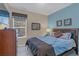 Bedroom with queen-size bed and adjacent bathroom at 2715 Manesty Ln, Kissimmee, FL 34747