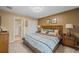 Spacious bedroom with king-size bed and ensuite bathroom at 2715 Manesty Ln, Kissimmee, FL 34747