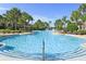 Large resort-style pool with water slide and lounge area at 2715 Manesty Ln, Kissimmee, FL 34747