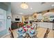 Casual dining area with glass table and chairs near kitchen at 2715 Manesty Ln, Kissimmee, FL 34747