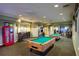 Community game room featuring pool tables, arcade games, and a DVD rental area at 2715 Manesty Ln, Kissimmee, FL 34747