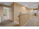 Upstairs hallway with carpet and neutral wall colors at 2715 Manesty Ln, Kissimmee, FL 34747