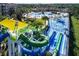 Aerial view of a vibrant water park with slides and play areas at 2715 Manesty Ln, Kissimmee, FL 34747